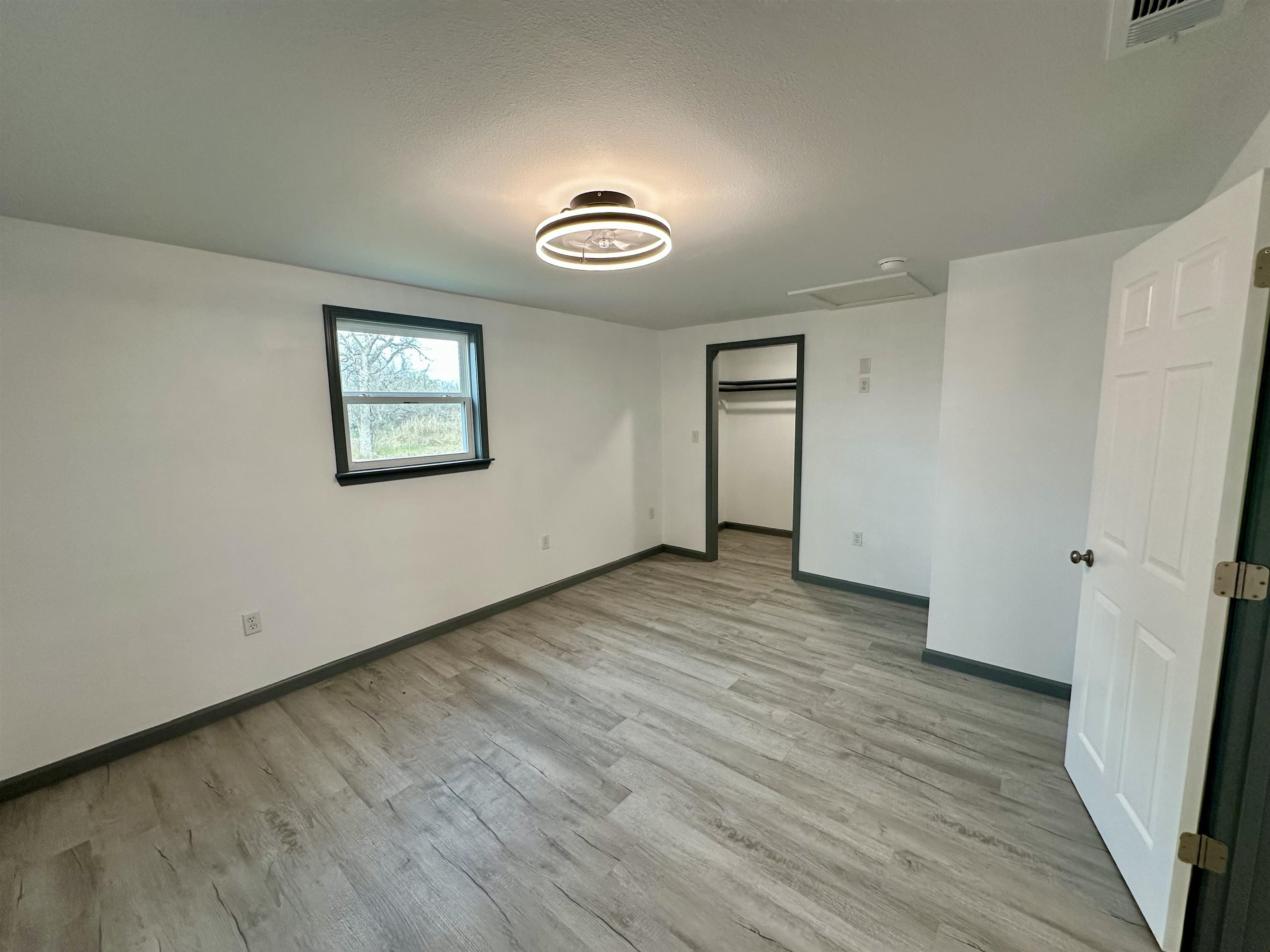 3410 Cactus Trail Kingsland, TX 78639 - Photo 21 of 26 a view of a room with wooden floor and window