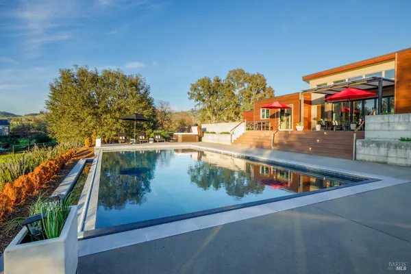 a view of swimming pool with outdoor seating
