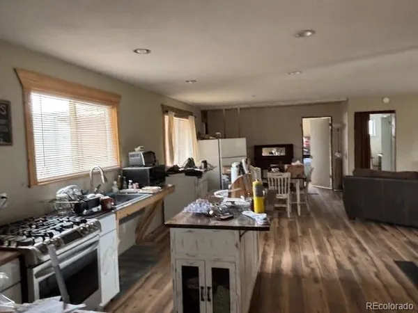 a kitchen with a stove and white cabinets