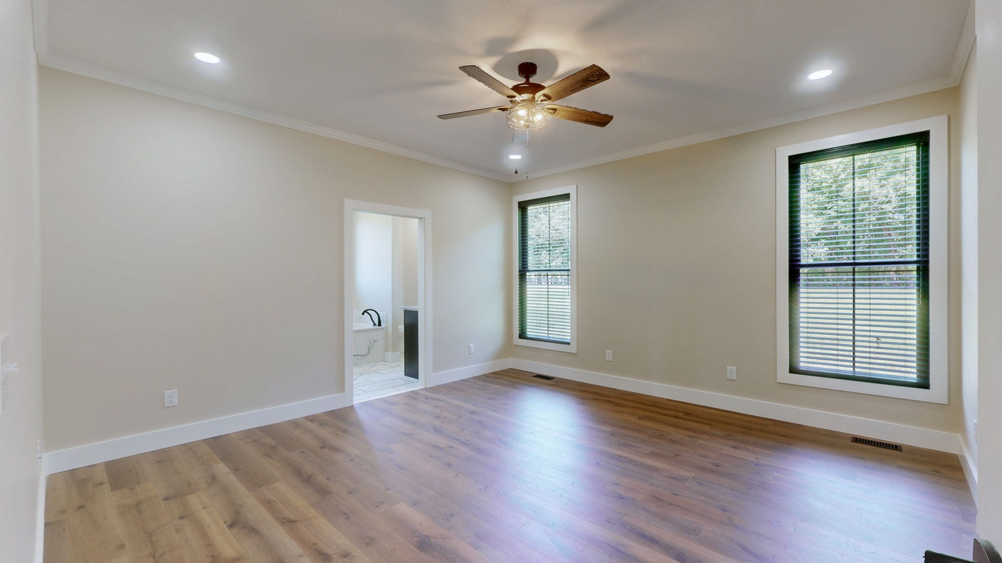 865 Alman Cemetery Road Paris, TN 38242 - Photo 13 of 41 a view of an empty room with wooden floor and a window
