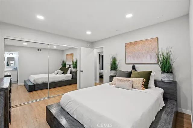 a bedroom with a large bed and a couch