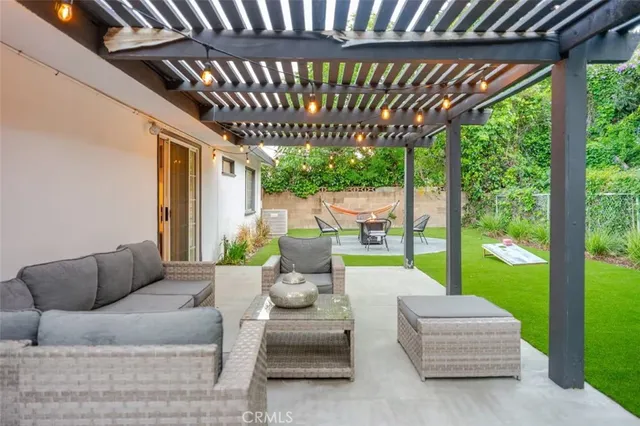 a outdoor living space with patio furniture and garden view