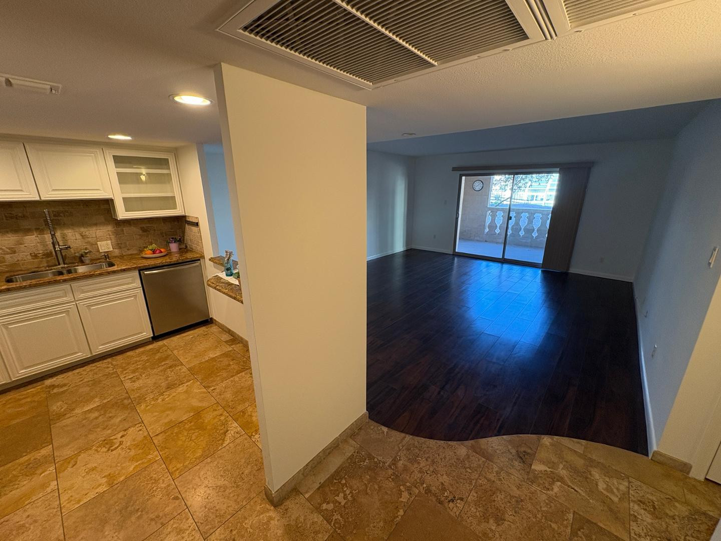 a kitchen with a sink stainless steel appliances and cabinets