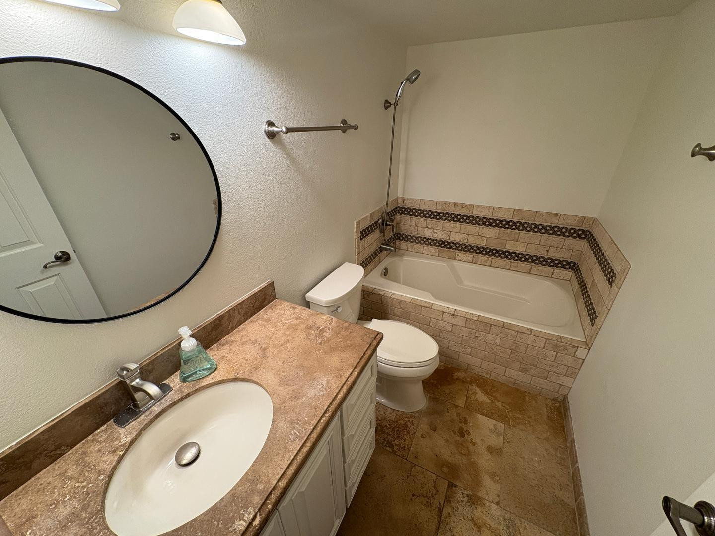 7850 East Camelback Road, Unit 109 Scottsdale, AZ 85251 - Photo 11 of 26 a bathroom with a sink mirror vanity and a toilet