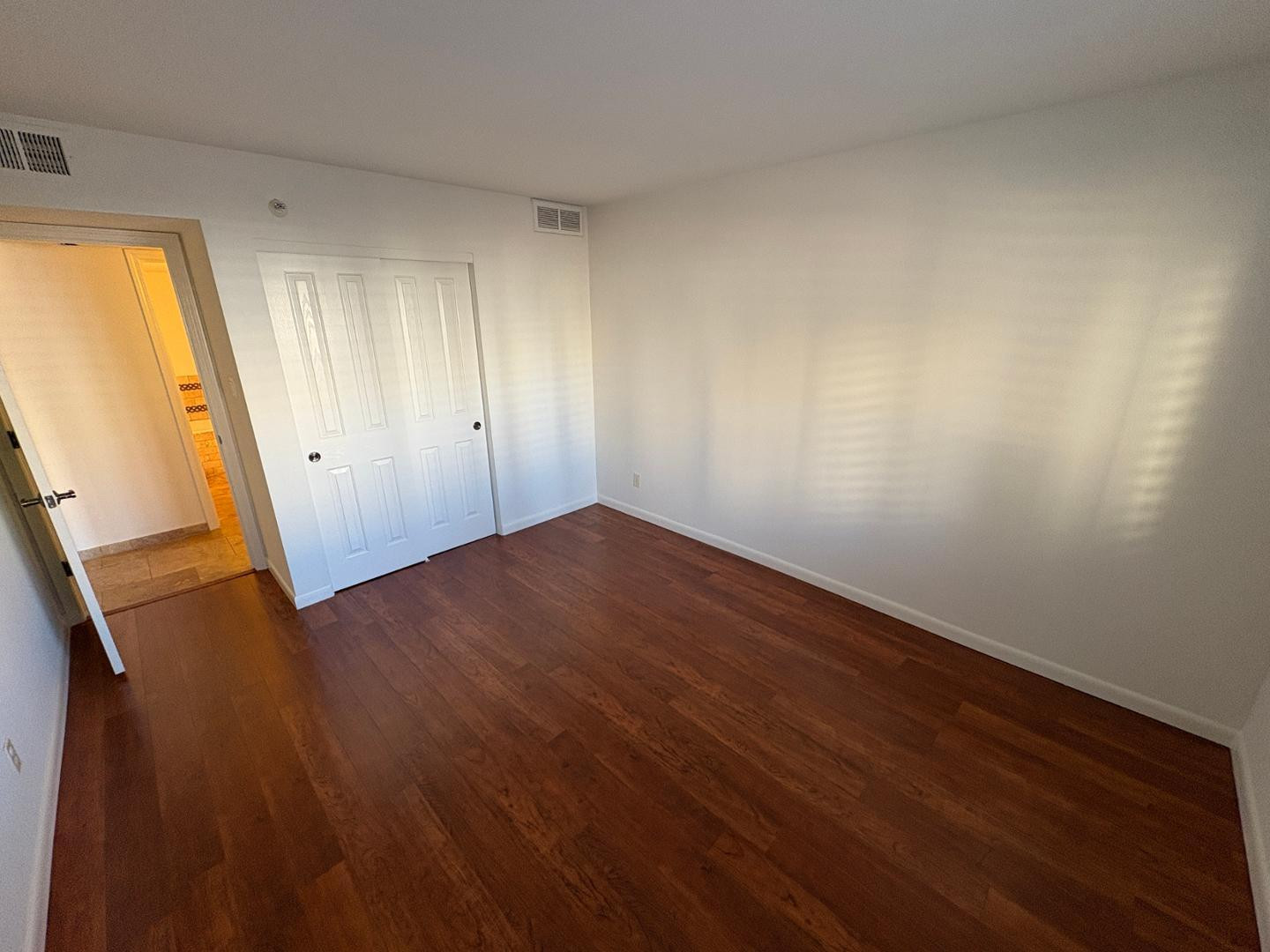 7850 East Camelback Road, Unit 109 Scottsdale, AZ 85251 - Photo 12 of 26 wooden floor in an empty room