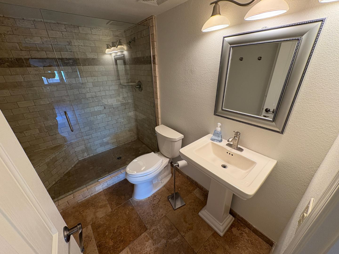 7850 East Camelback Road, Unit 109 Scottsdale, AZ 85251 - Photo 18 of 26 a bathroom with a sink a toilet and shower