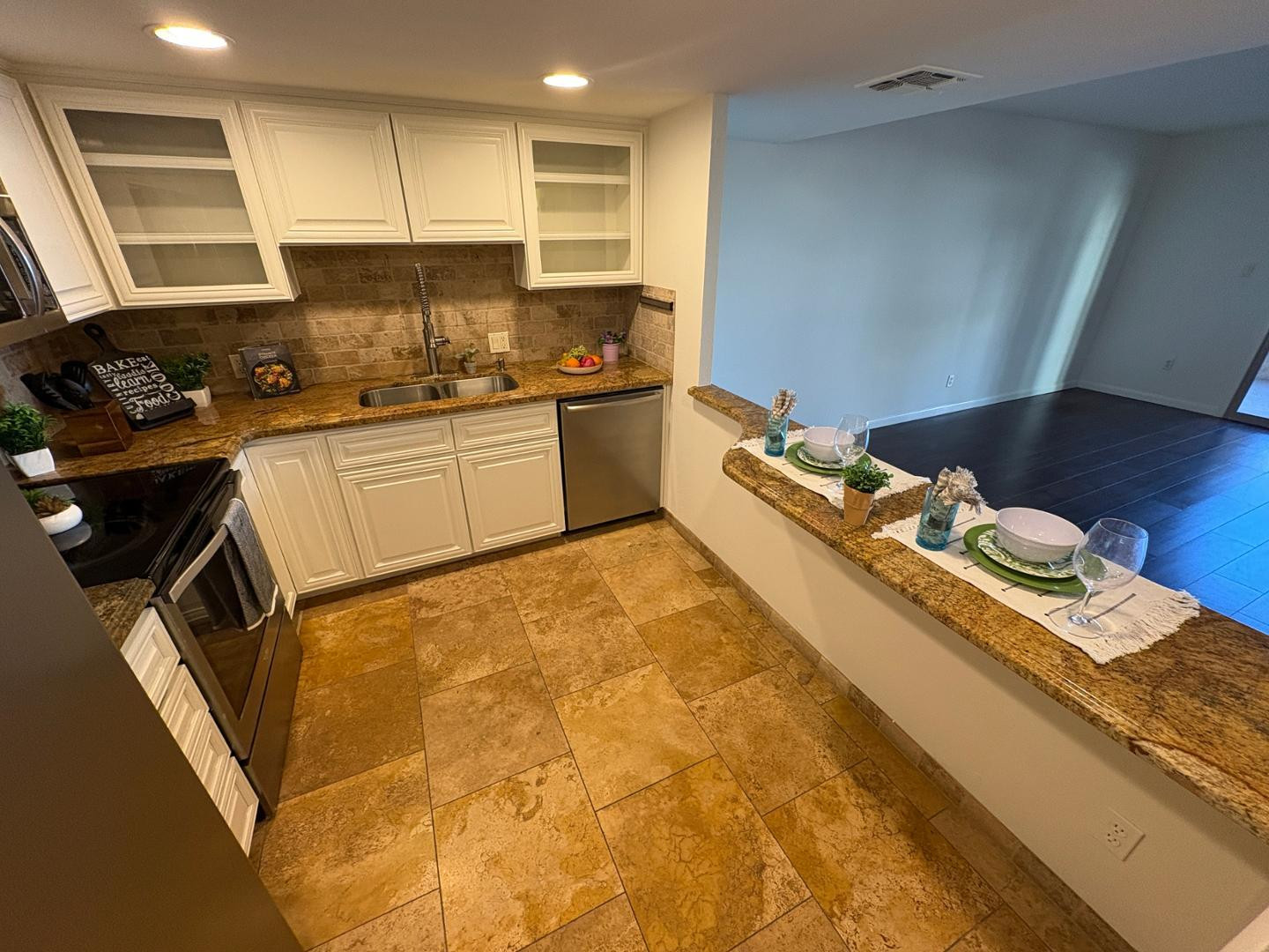 7850 East Camelback Road, Unit 109 Scottsdale, AZ 85251 - Photo 2 of 26 a kitchen with a sink appliances and cabinets