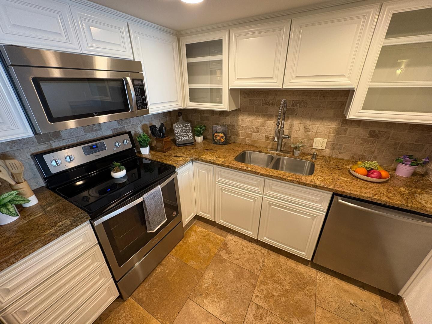 7850 East Camelback Road, Unit 109 Scottsdale, AZ 85251 - Photo 6 of 26 a kitchen with a sink appliances and cabinets
