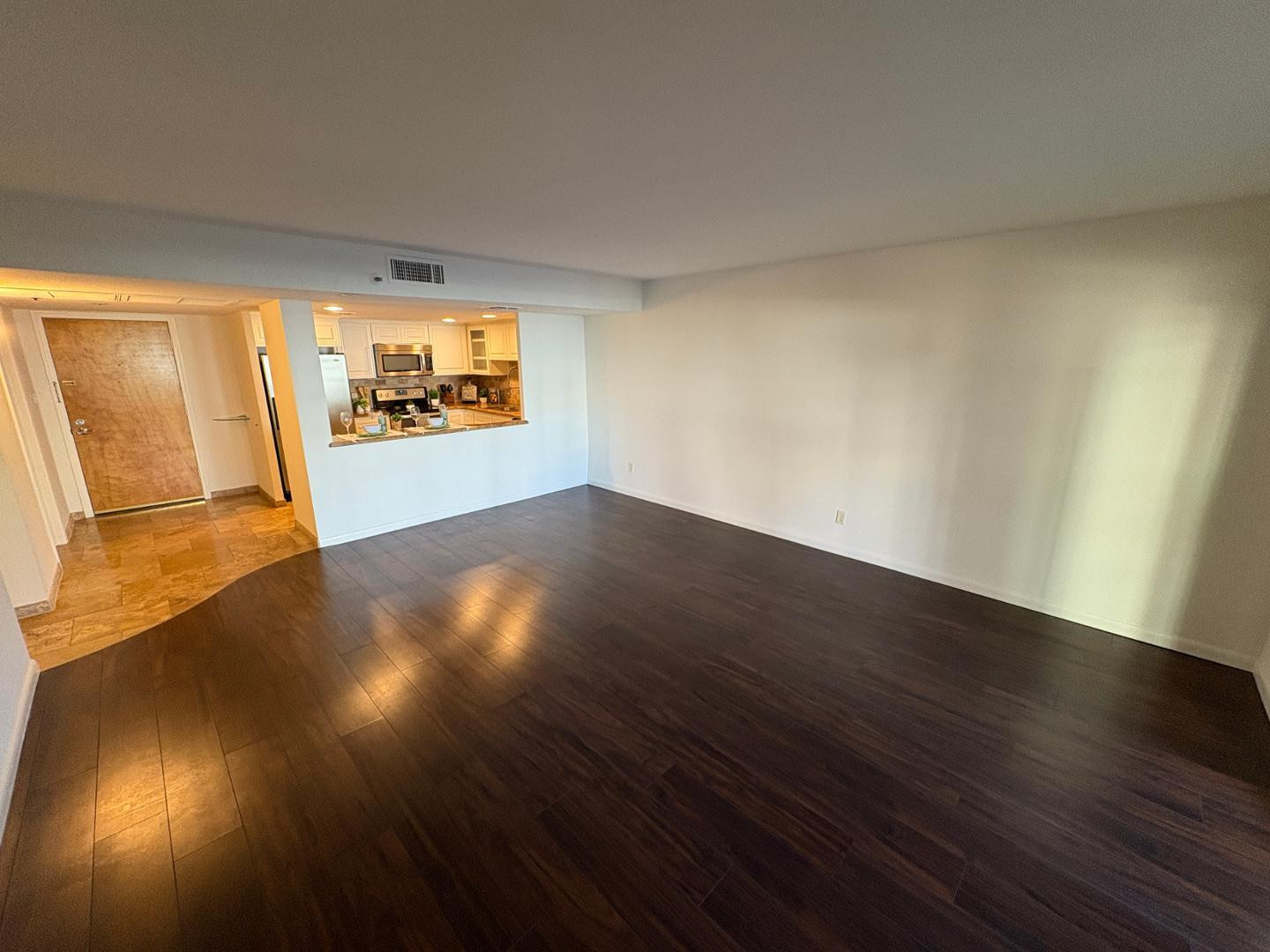 7850 East Camelback Road, Unit 109 Scottsdale, AZ 85251 - Photo 7 of 26 a view of empty room with wooden floor