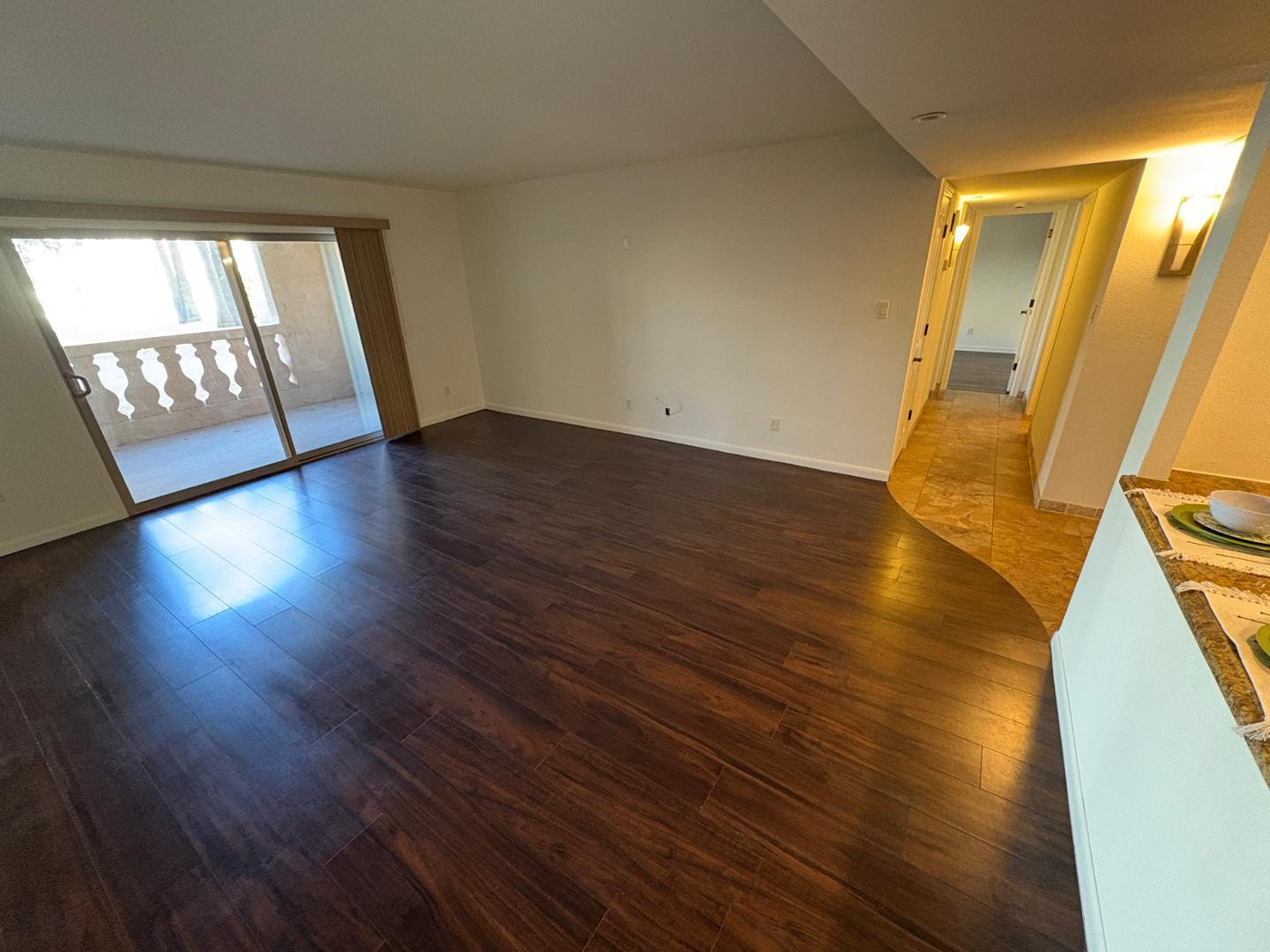 7850 East Camelback Road, Unit 109 Scottsdale, AZ 85251 - Photo 9 of 26 a view of an empty room with wooden floor and a window