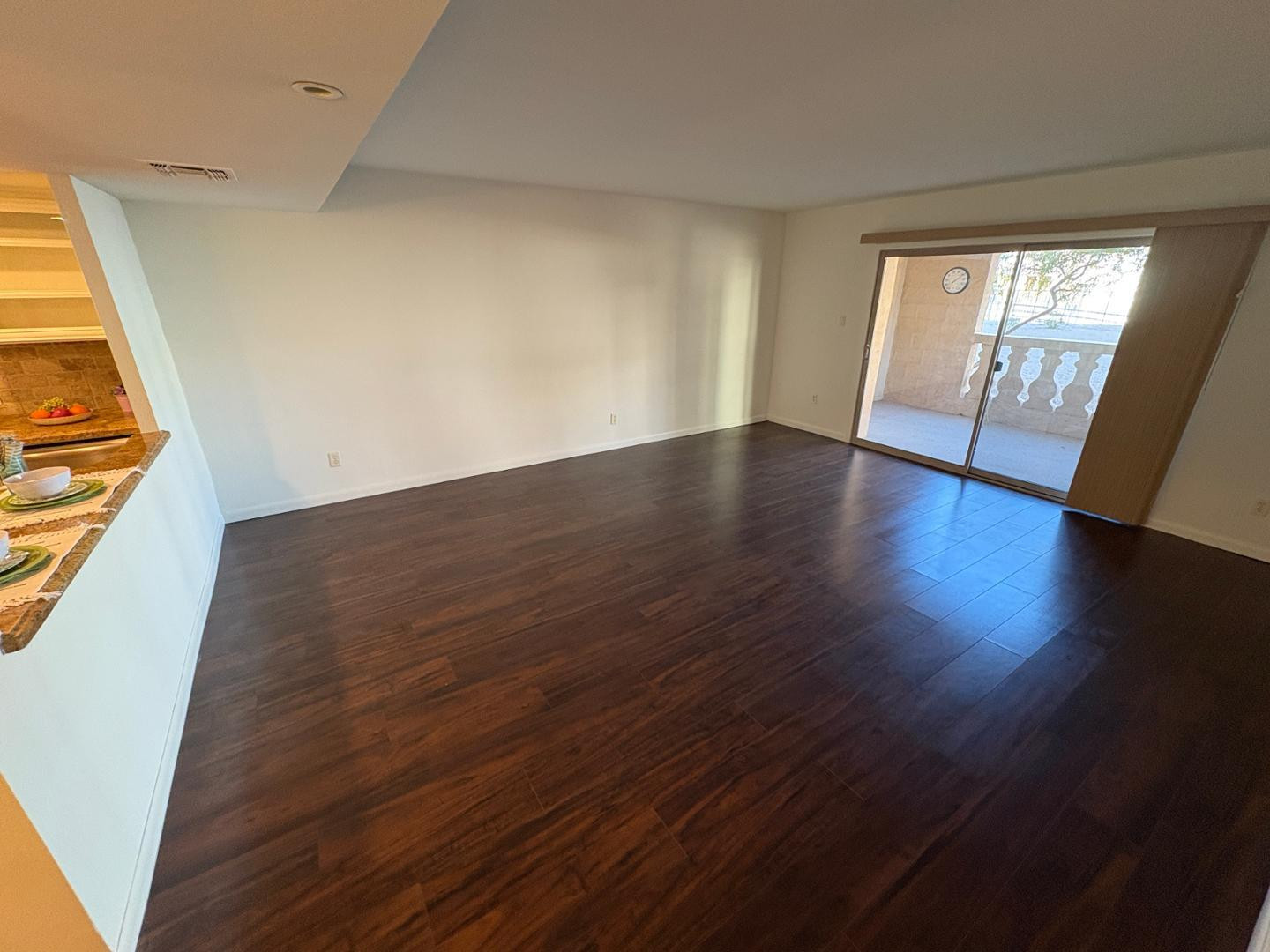 7850 East Camelback Road, Unit 109 Scottsdale, AZ 85251 - Photo 10 of 26 wooden floor in an empty room with a window