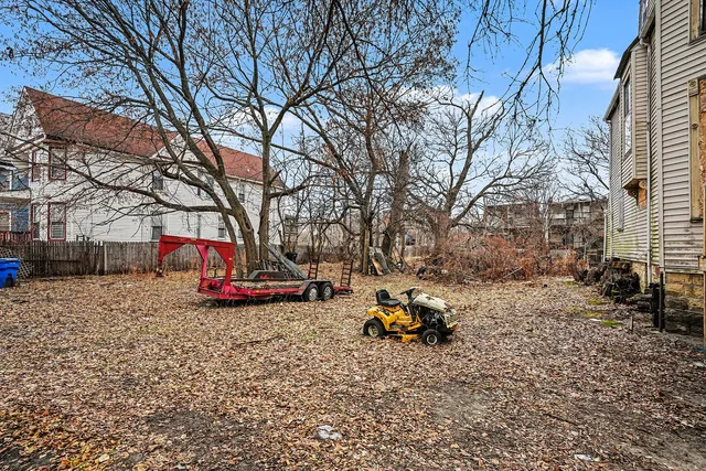 a view of a park with large trees