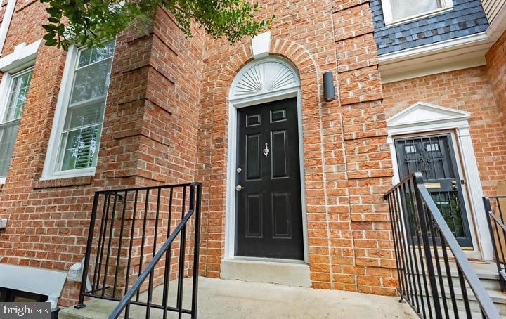Charming brick facade with inviting entry.