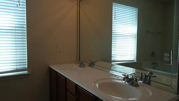 a bathroom with a sink and a window