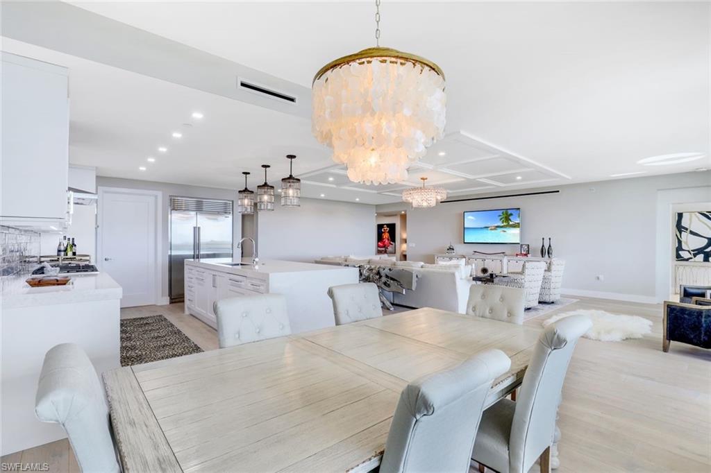 13915 Old Coast Road, Unit 502 Naples, FL 34110 - Photo 11 of 31 a view of a dining room with furniture