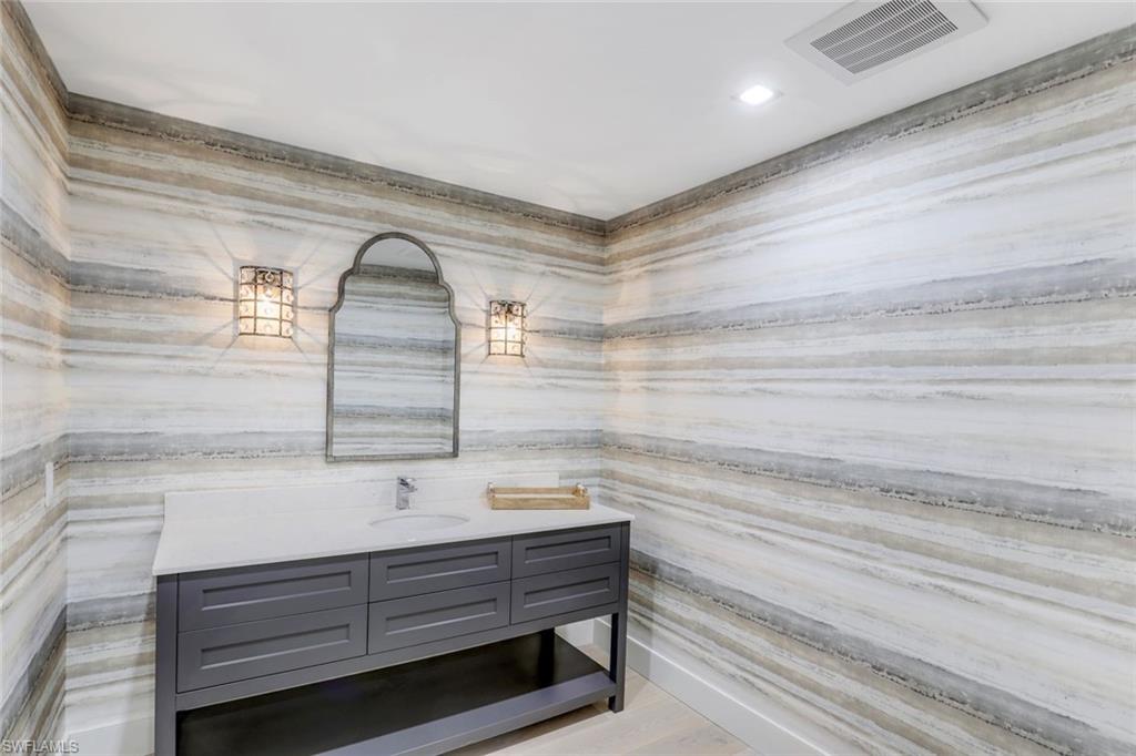 13915 Old Coast Road, Unit 502 Naples, FL 34110 - Photo 18 of 31 a bathroom with a sink and a bathtub