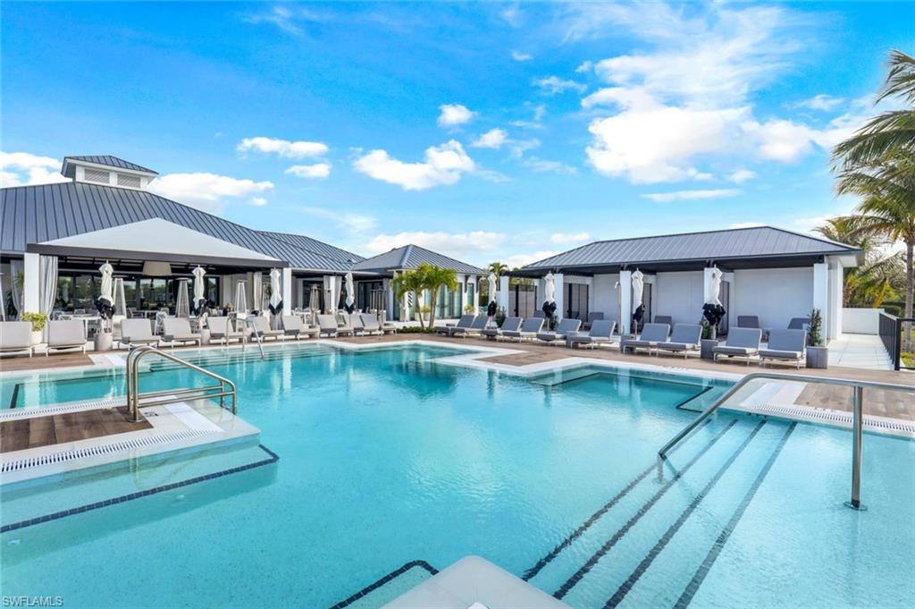 13915 Old Coast Road, Unit 502 Naples, FL 34110 - Photo 24 of 31 a view of a swimming pool with outdoor seating