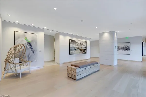 a living room with furniture and a painting