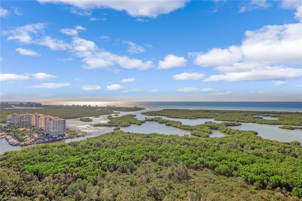 13915 Old Coast Road, Unit 502 Naples, FL 34110 - Photo 29 of 31 a view of an ocean and beach