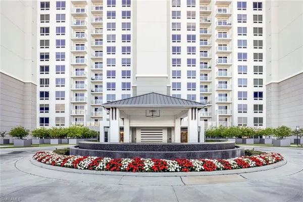 a front view of building with outdoor space and parking