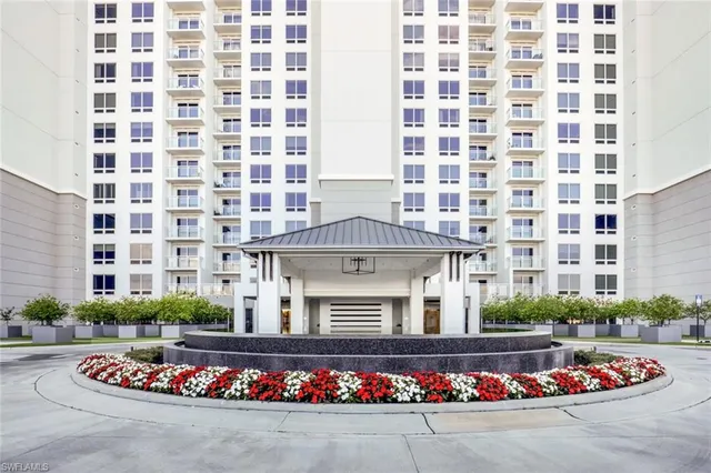 a front view of building with outdoor space and parking