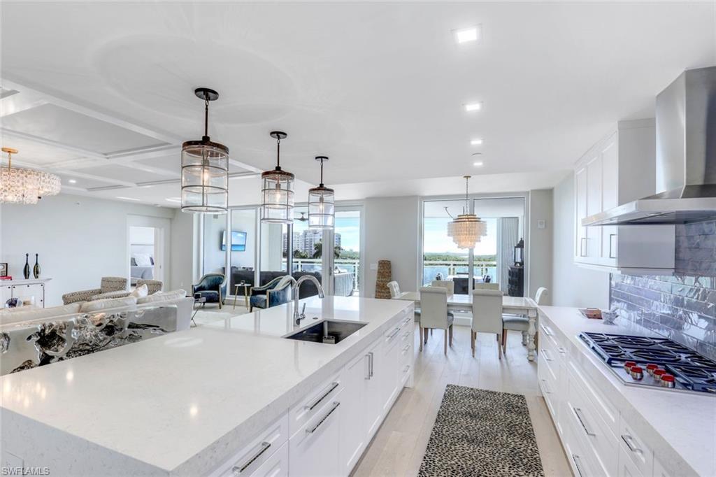 13915 Old Coast Road, Unit 502 Naples, FL 34110 - Photo 9 of 31 a view of a kitchen and dining room
