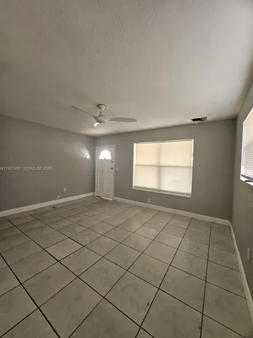 a view of an empty room and window