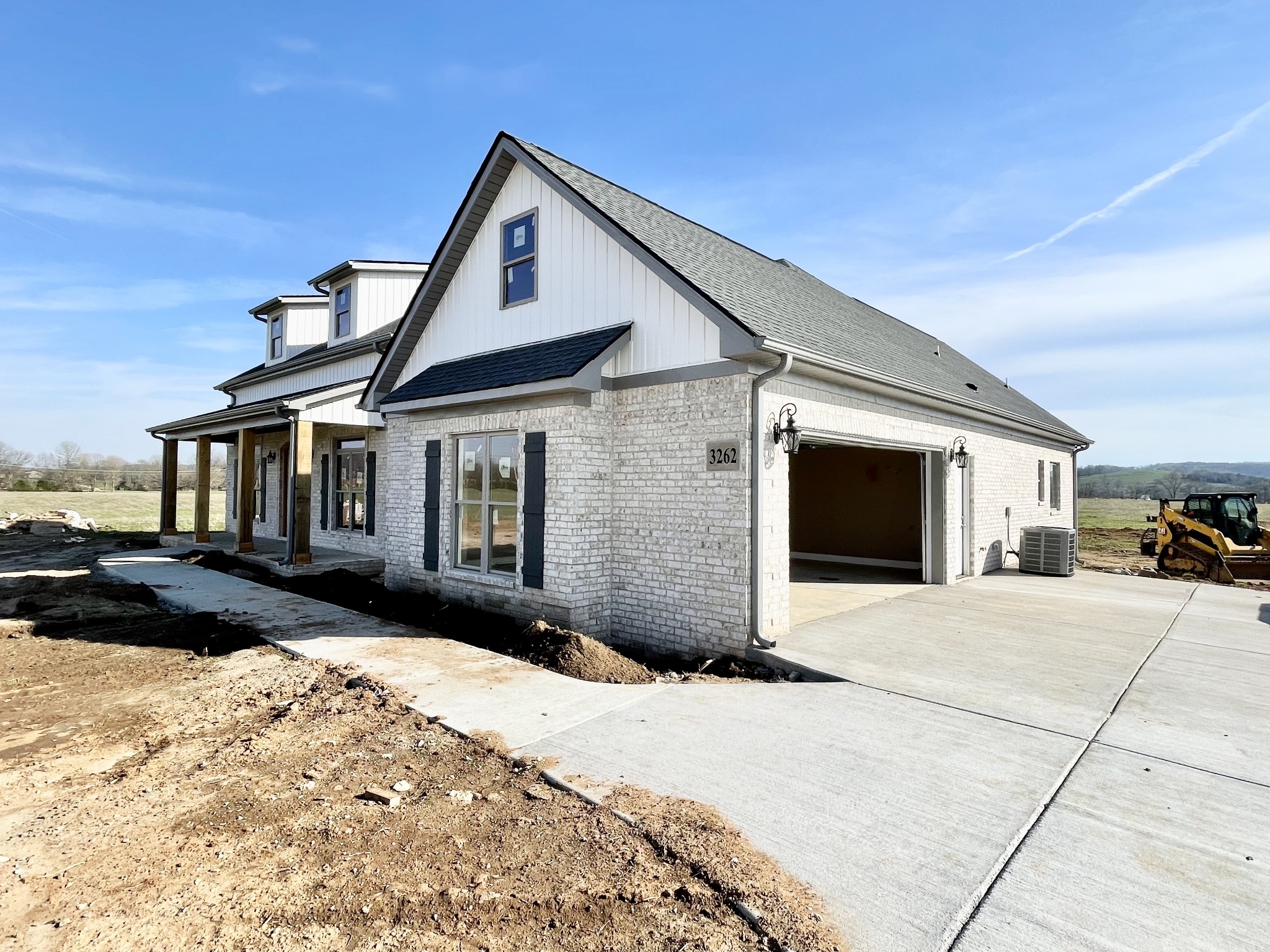 3262 Ostella Road Cornersville, TN 37047 - Photo 2 of 11 a front view of a house with a yard