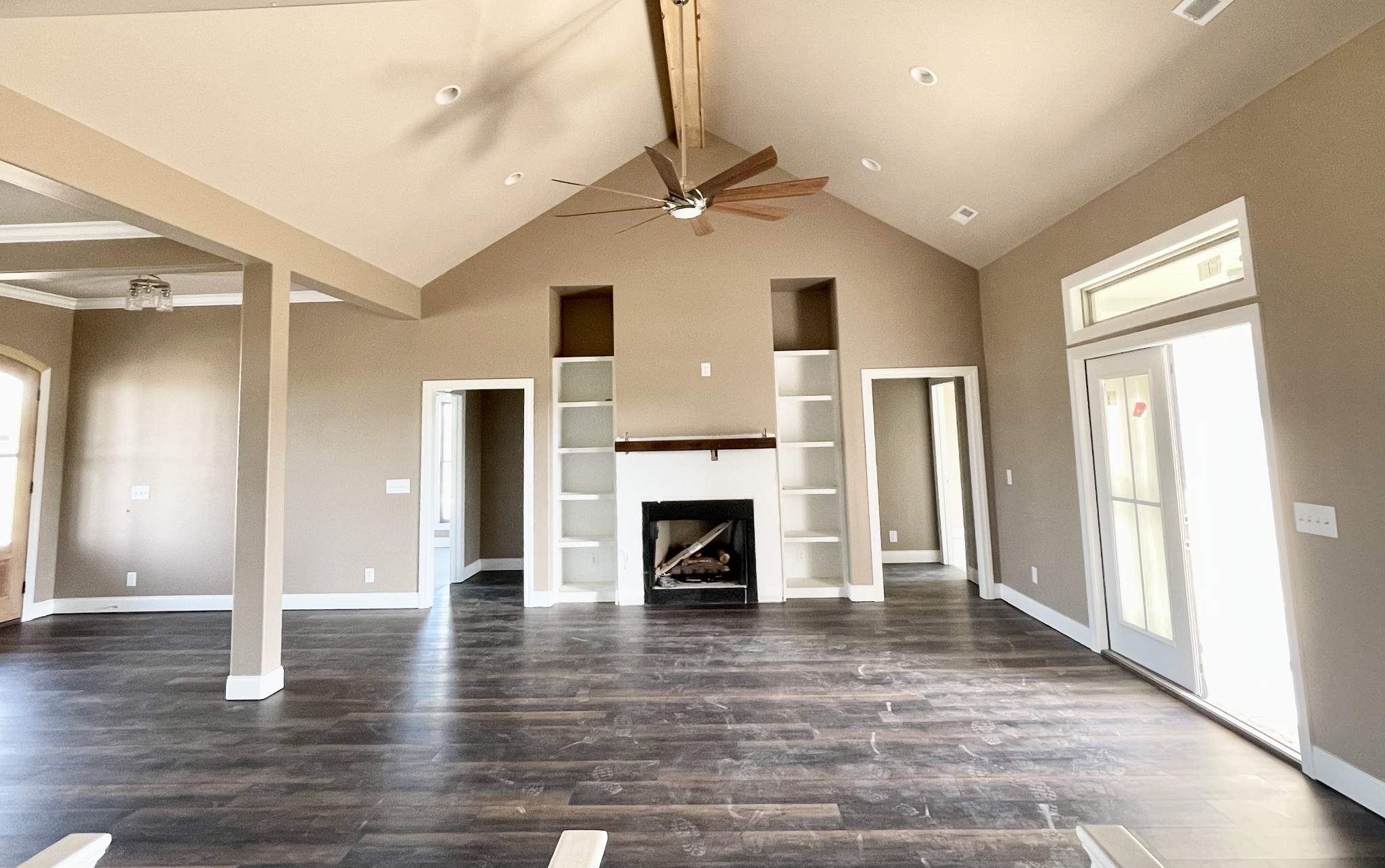 3262 Ostella Road Cornersville, TN 37047 - Photo 5 of 11 a view of a livingroom with a fireplace wooden floor and a ceiling fan
