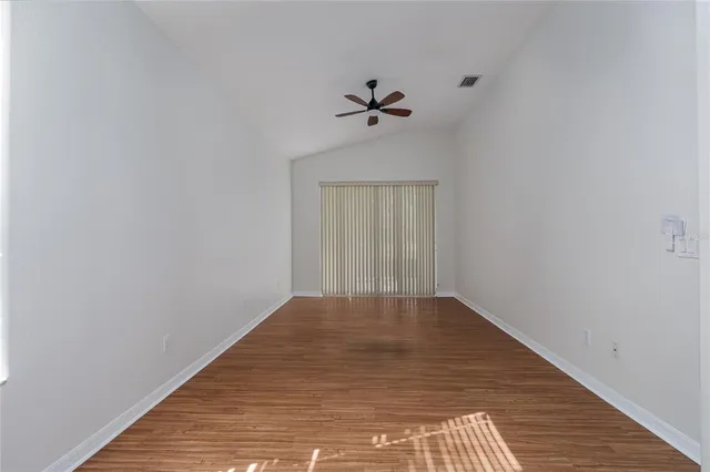 a view of a room with window and wooden floor