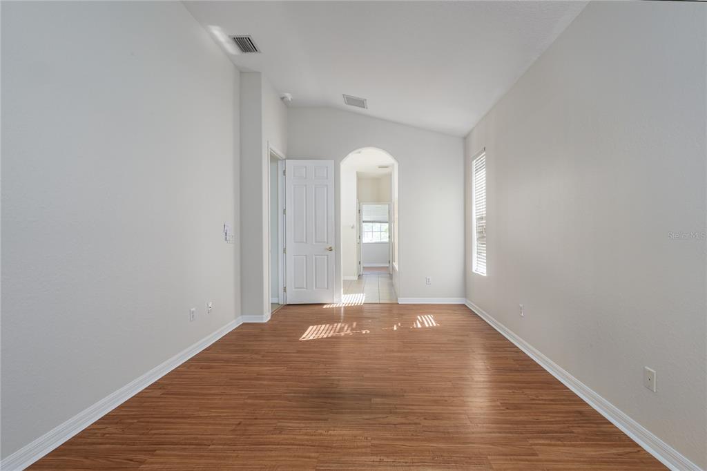 4420 85th Ave Circle East Parrish, FL 34219 - Photo 12 of 40 a view of a room with window and wooden floor