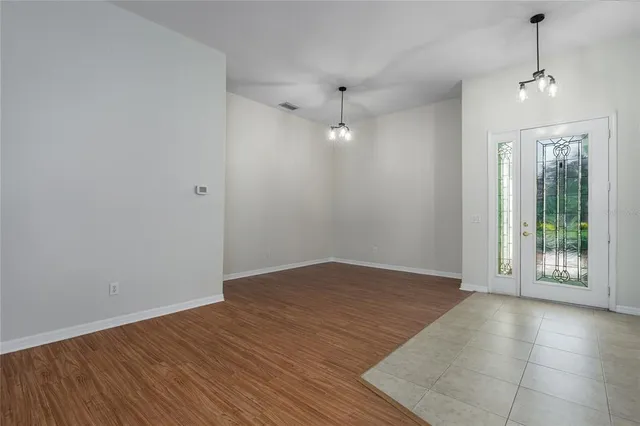 a view of room with window and hardwood floor