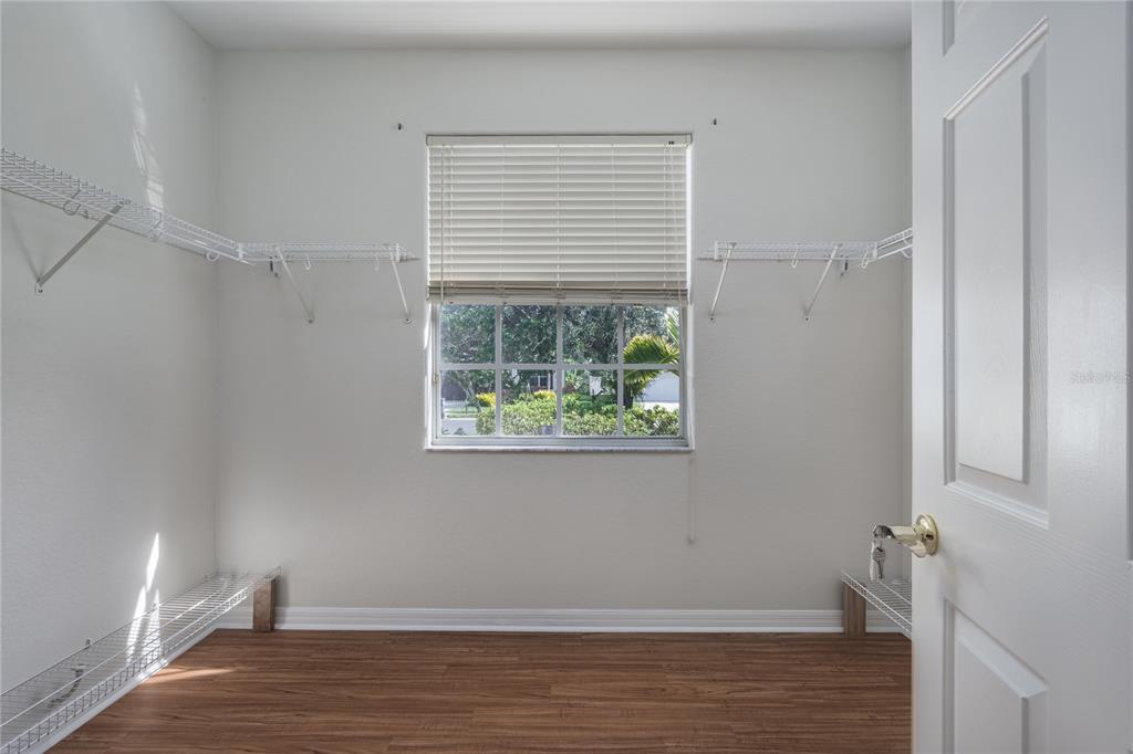 4420 85th Ave Circle East Parrish, FL 34219 - Photo 15 of 40 a view of room with window and hardwood floor