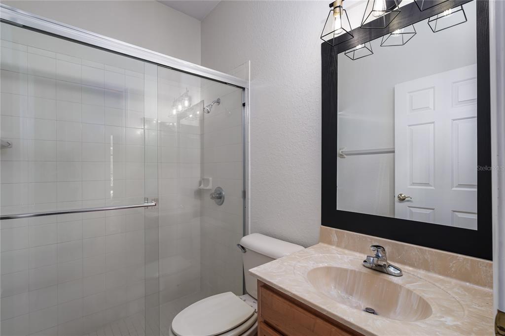 4420 85th Ave Circle East Parrish, FL 34219 - Photo 19 of 40 a bathroom with a sink toilet and shower