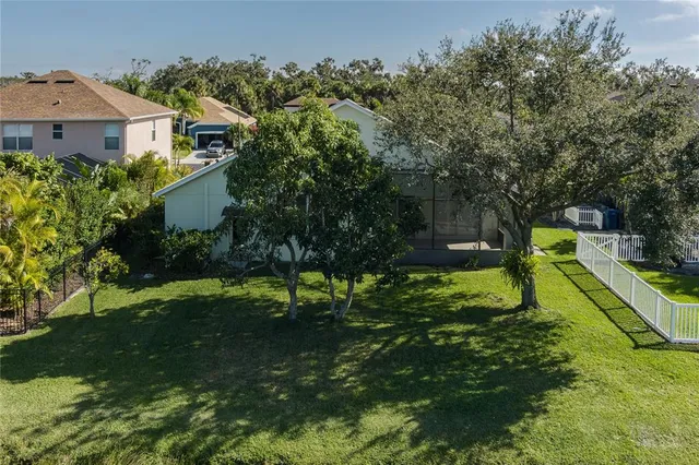 an aerial view of a house with a lake view