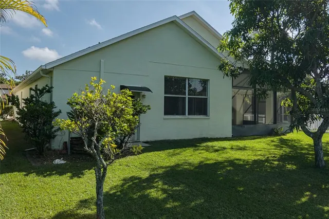 a view of a lake with houses in the back