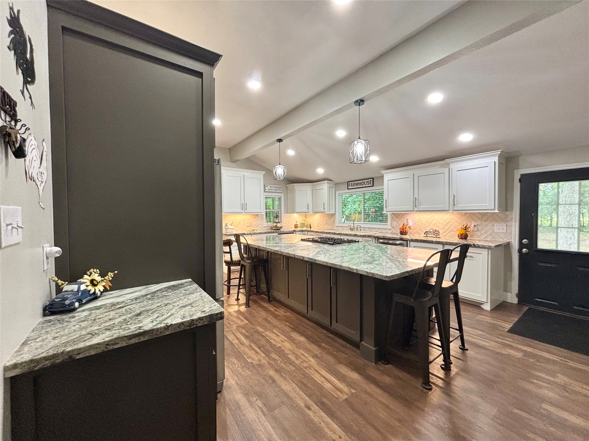 516 County Road 4800 Warren, TX 77664 - Photo 14 of 50 a kitchen with a kitchen island wooden cabinets and counter space