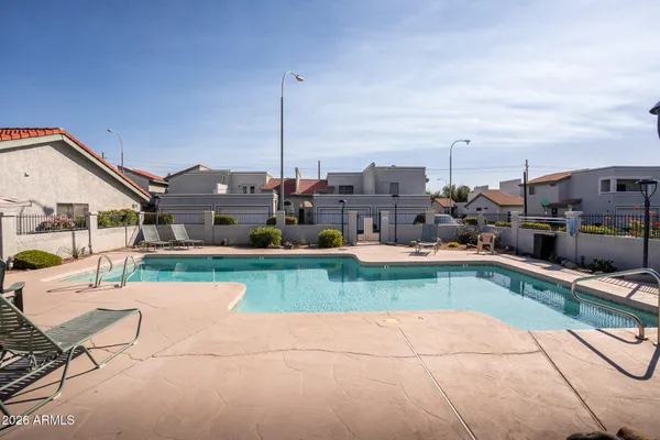 a view of a swimming pool with a lounge chairs