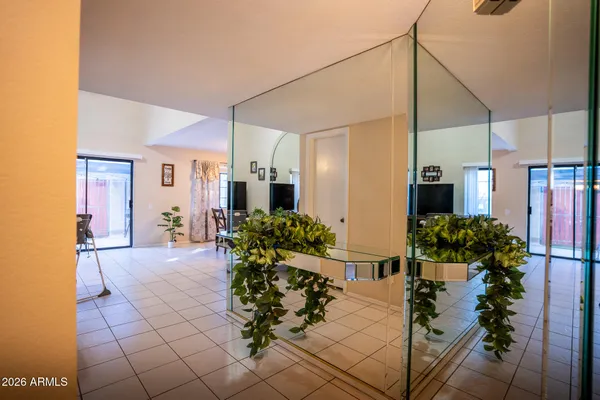 a view of a house with flower plants