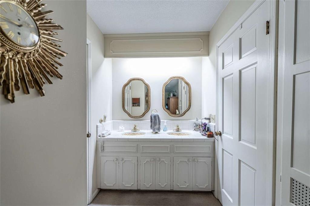 16 Cinnamon Lane Northeast Rome, GA 30161 - Photo 12 of 23 a bathroom with a sink a vanity and a mirror