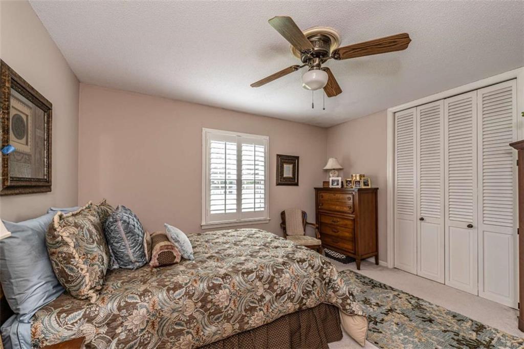 16 Cinnamon Lane Northeast Rome, GA 30161 - Photo 16 of 23 a bedroom with a bed dresser and a window