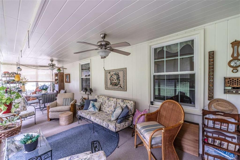 16 Cinnamon Lane Northeast Rome, GA 30161 - Photo 18 of 23 a living room with furniture a chandelier and a window