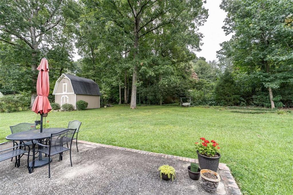 16 Cinnamon Lane Northeast Rome, GA 30161 - Photo 20 of 23 a view of a house with backyard and sitting area