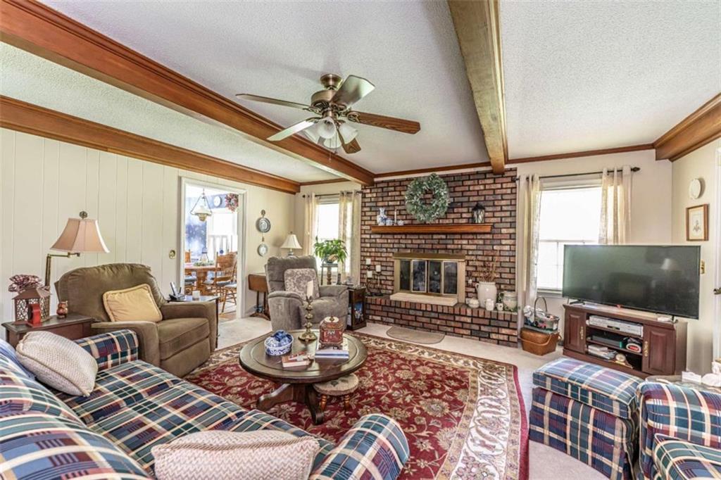 16 Cinnamon Lane Northeast Rome, GA 30161 - Photo 4 of 23 a living room with furniture and a flat screen tv