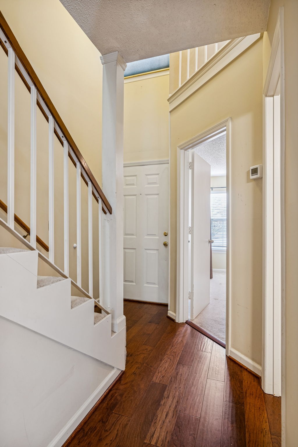 357 Yorkshire Circle Nashville, TN 37211 - Photo 15 of 44 a view of a hallway with wooden floor and staircase
