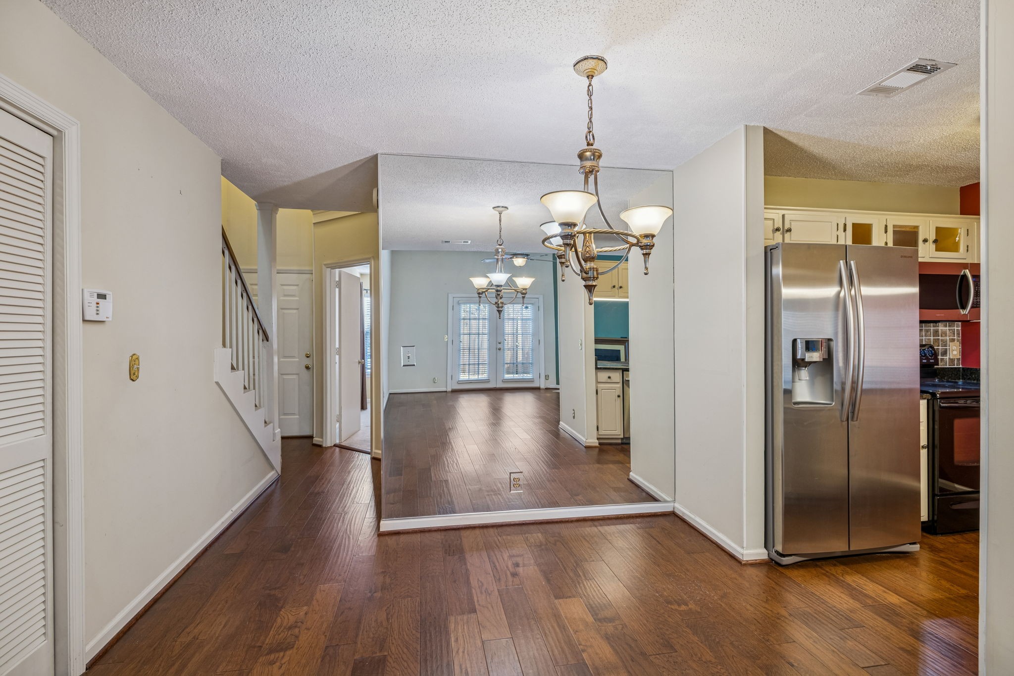 357 Yorkshire Circle Nashville, TN 37211 - Photo 18 of 44 a view of a hallway with wooden floor and a living room