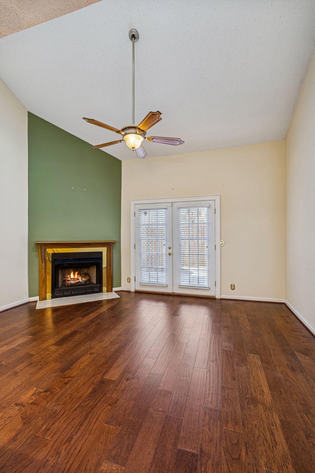 357 Yorkshire Circle Nashville, TN 37211 - Photo 25 of 44 a view of an empty room with wooden floor fireplace and a window
