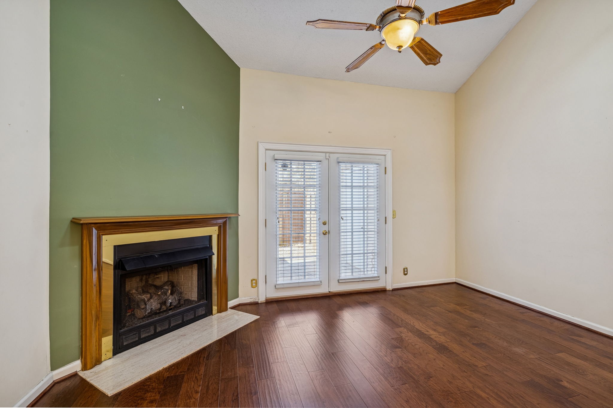 357 Yorkshire Circle Nashville, TN 37211 - Photo 26 of 44 an empty room with windows fireplace and wooden floor