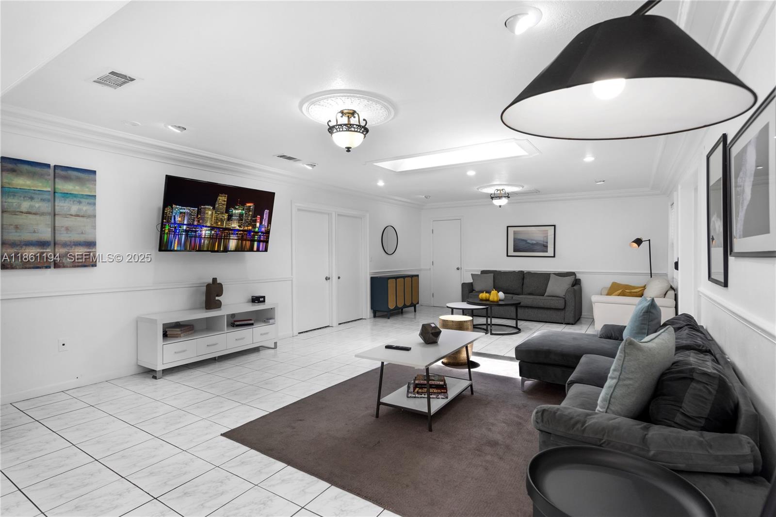 520 Southwest 22nd Road Miami, FL 33129 - Photo 21 of 71 a living room with furniture a rug and a mirror