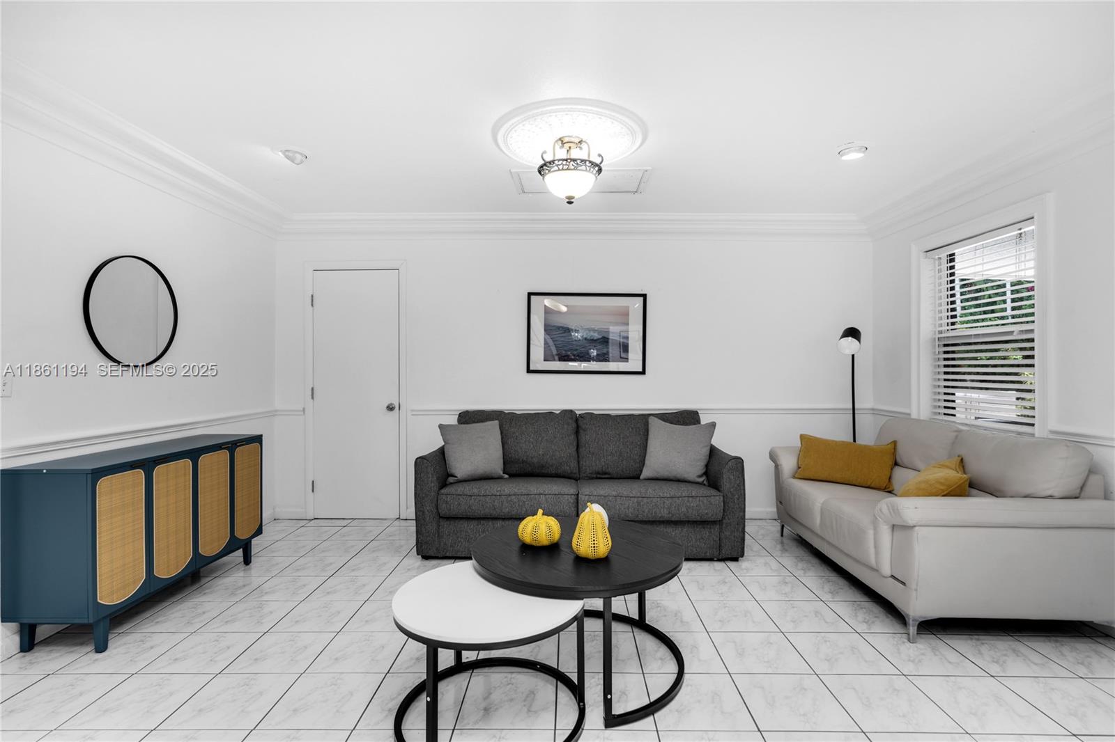 520 Southwest 22nd Road Miami, FL 33129 - Photo 24 of 71 a living room with furniture a rug and a window